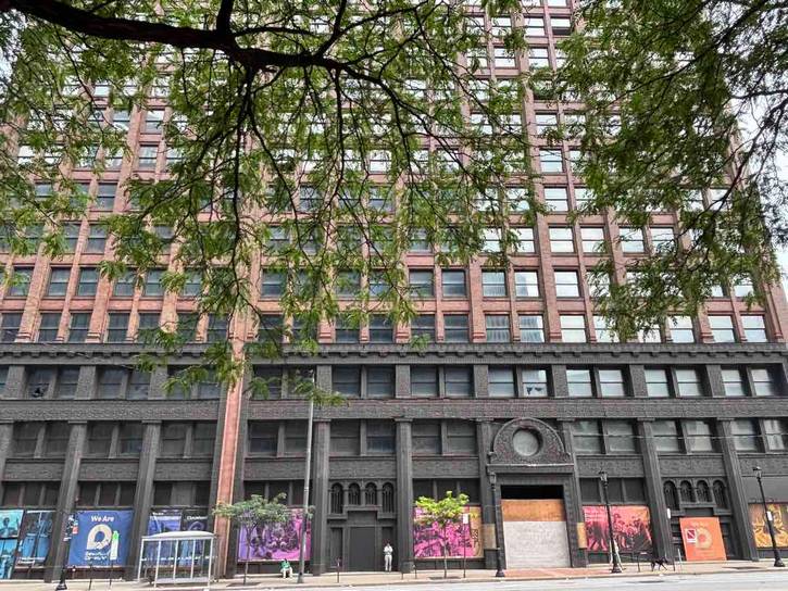 The Rockefeller Building today sits abandoned, boarded up in parts and vandalized.